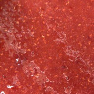 Raspberry jam with a bright colour and smooth, spoonable texture